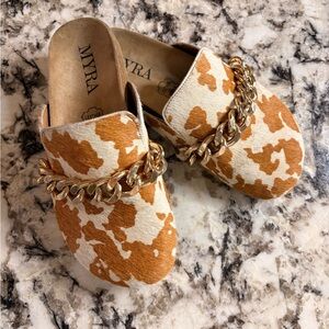 Myra Cow Print Mules with Gold Chain